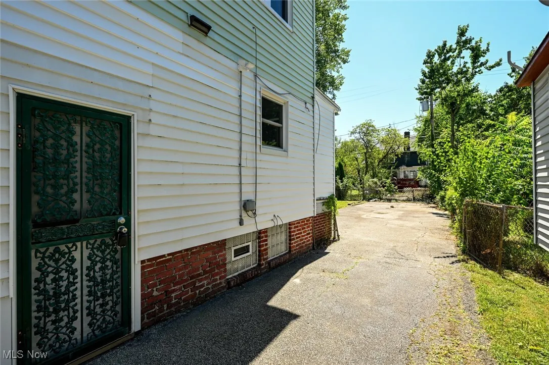View of home's exterior featuring driveway