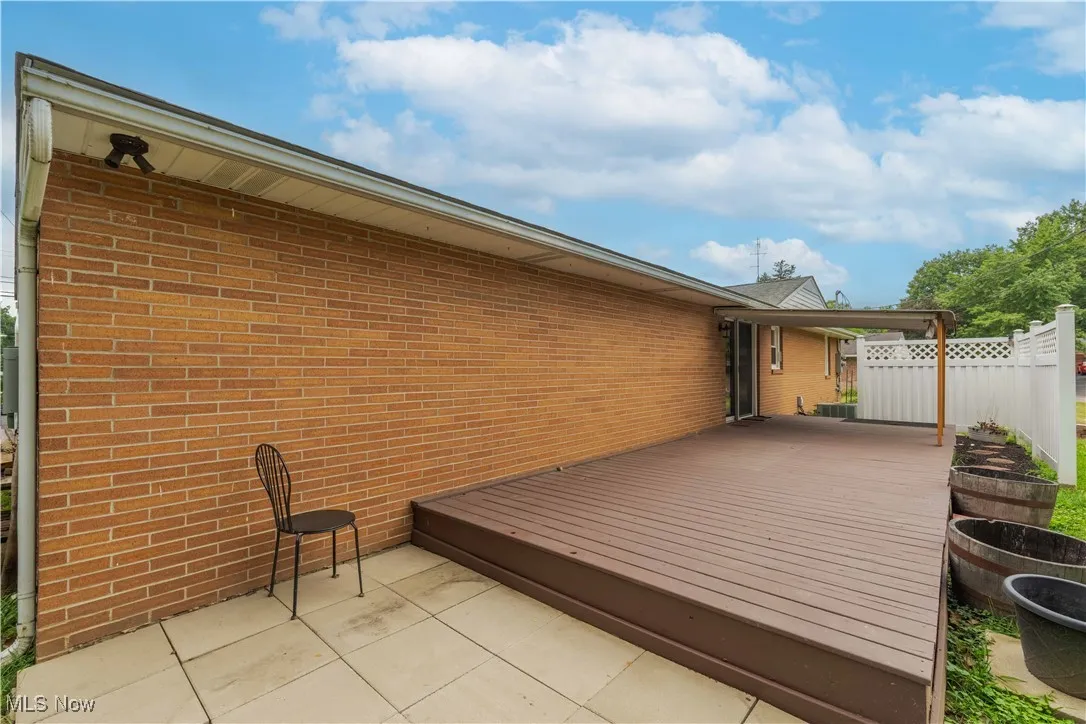 Wooden deck featuring a patio area