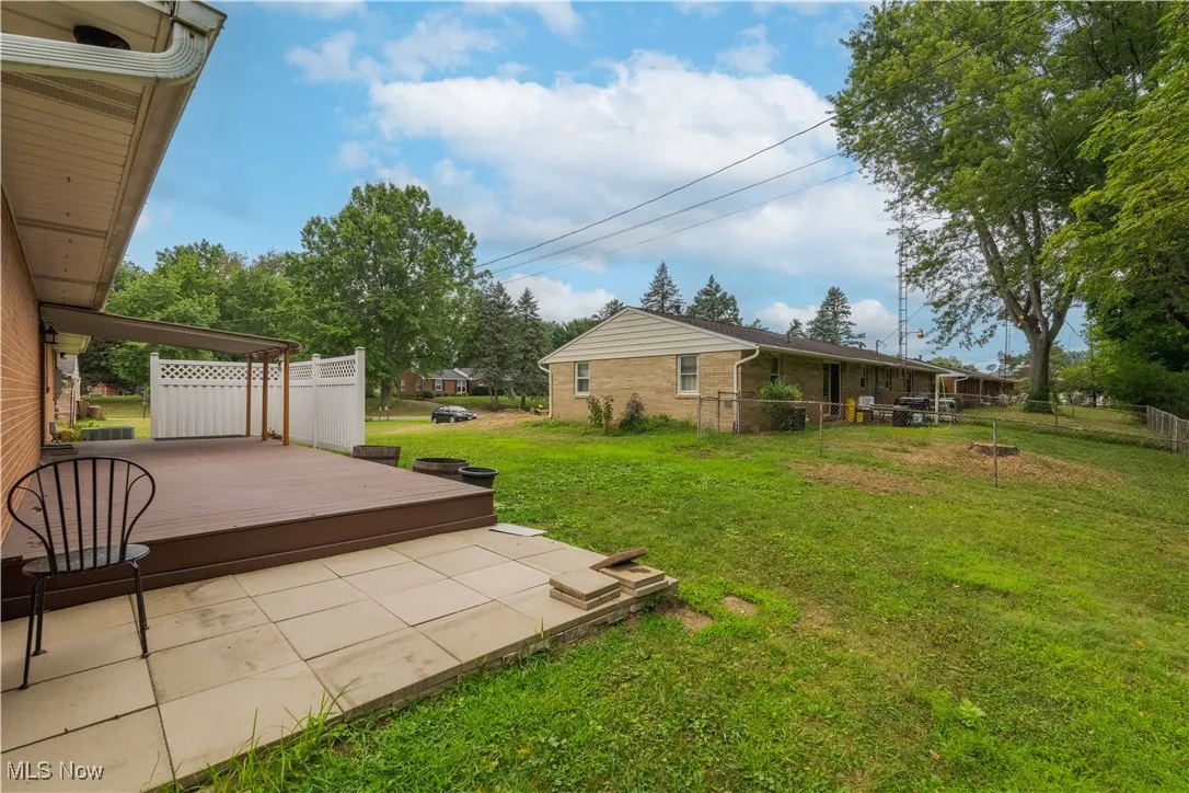 View of yard with a wooden deck