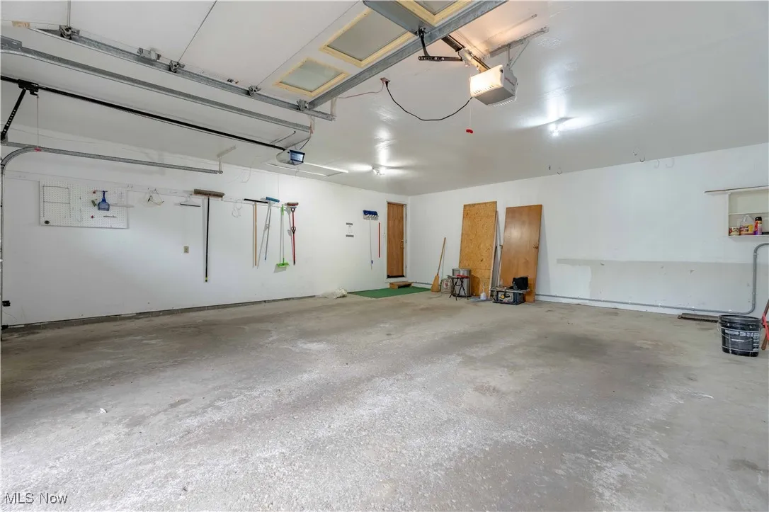 Garage featuring a garage door opener