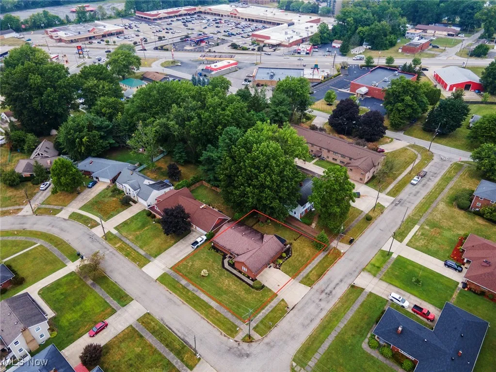 Aerial view of property's location featuring nearby suburban area