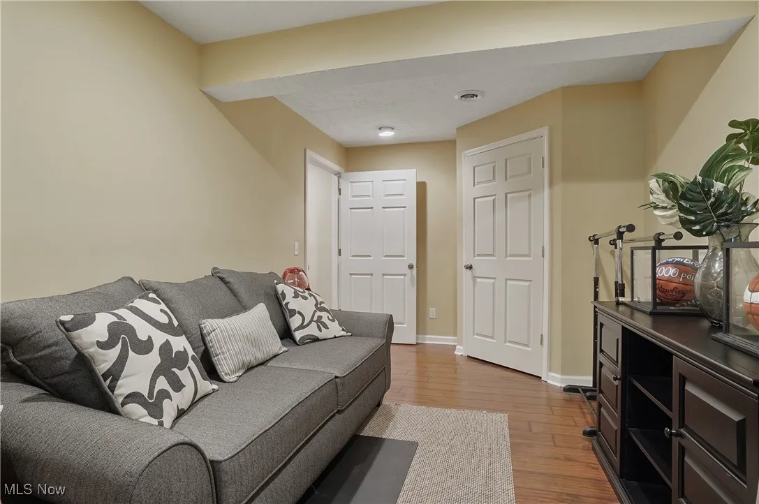 Living room with wood finished floors and baseboards
