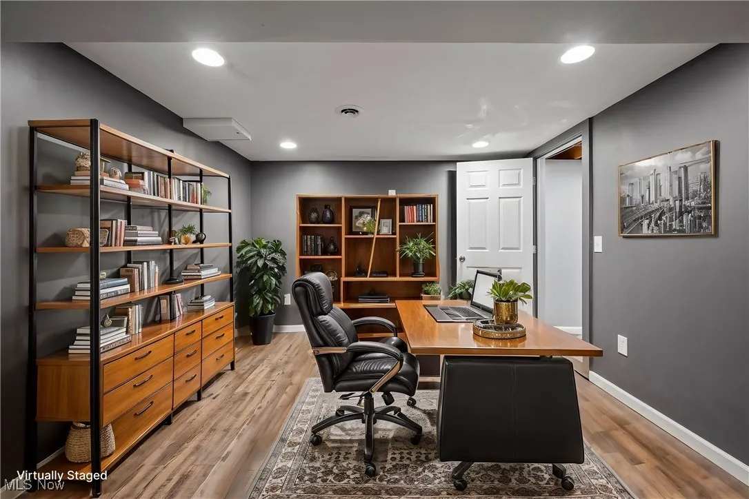 Virtually staged additional office/crafting space in the basement