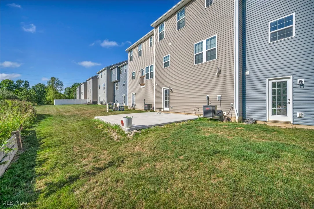 Rear view of house with a patio area