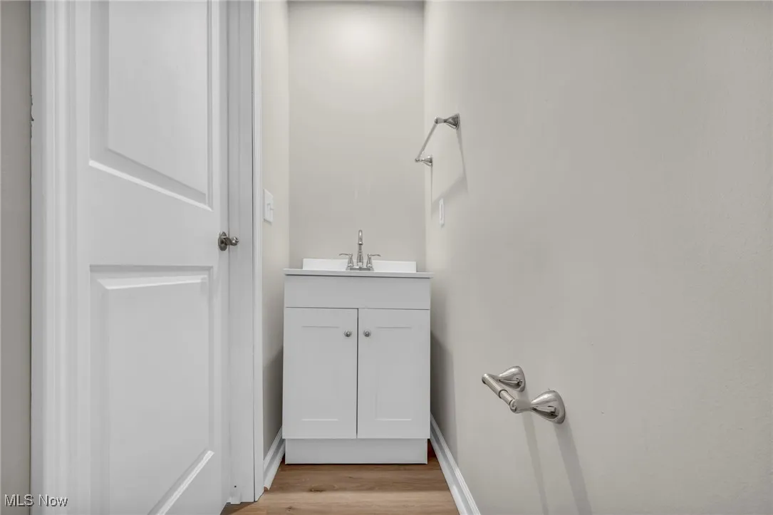 Bathroom with vanity and light wood-style floors