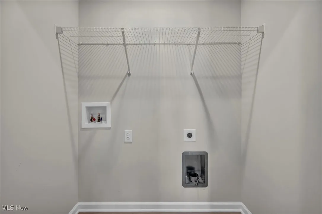 Laundry area with hookup for a washing machine and hookup for an electric dryer