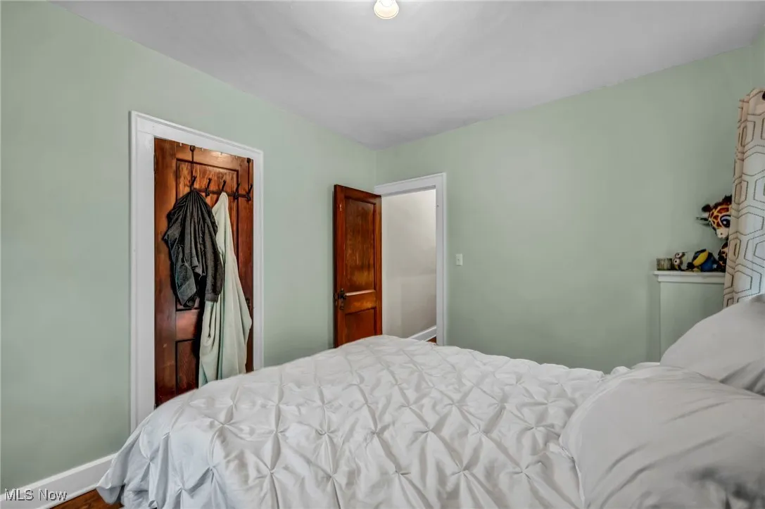 Bedroom with a closet and baseboards