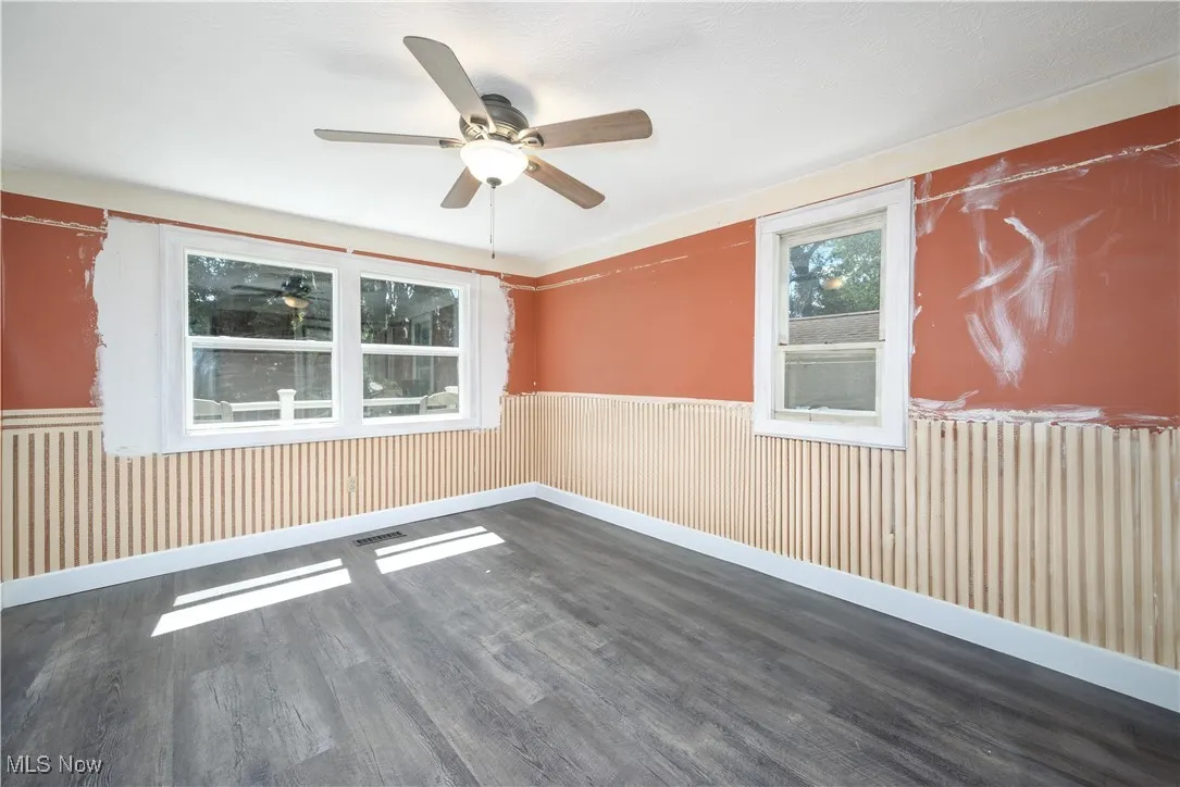 First floor bedroom featuring waterproof luxury vinyl floor and a ceiling fan