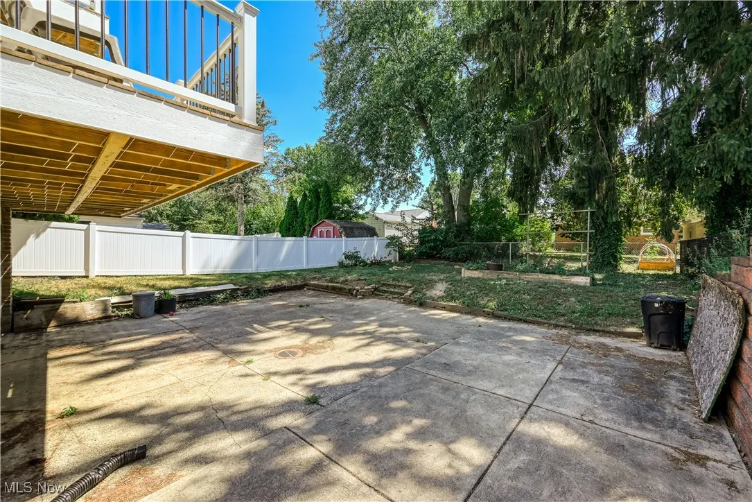 Fenced backyard with a patio area