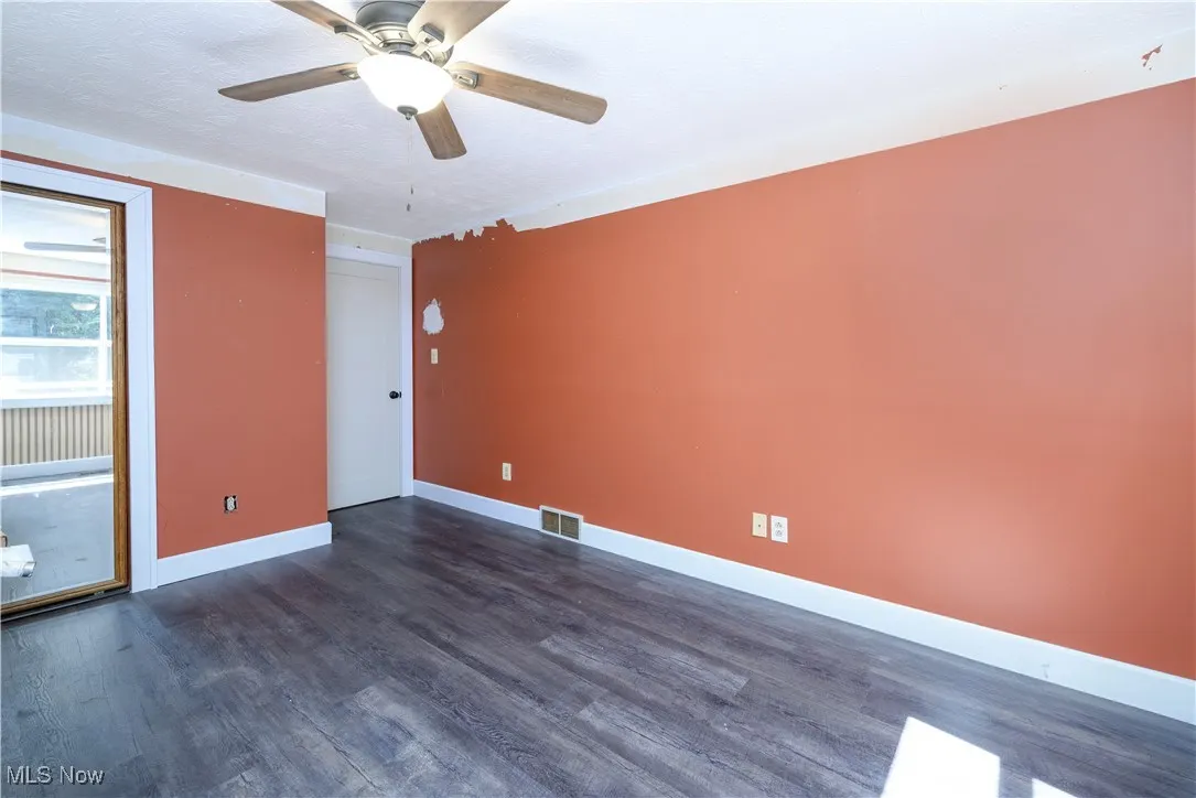 First floor bedroom featuring waterproof luxury vinyl floor and a ceiling fan