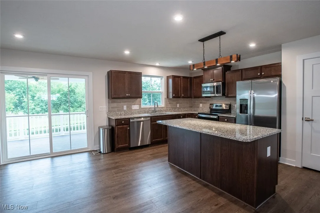 Slider door to covered patio of kitchen and dining room