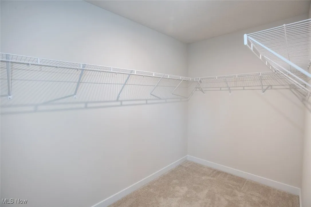 Spacious walk in closet in the primary bedroom