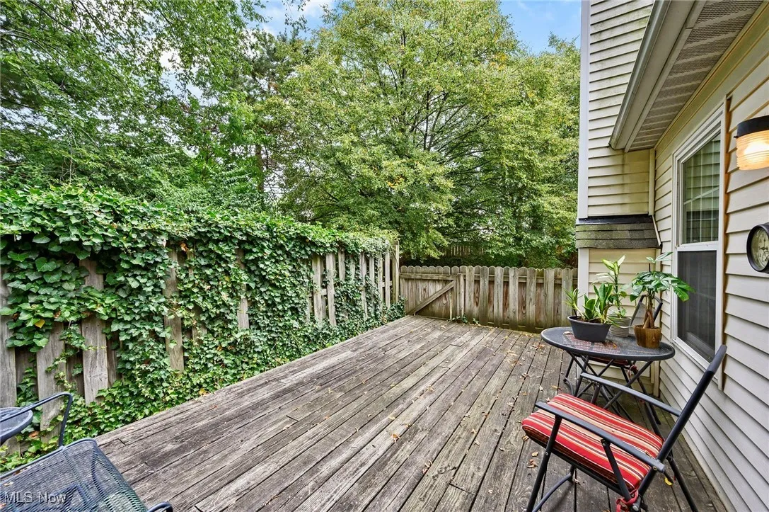 Wooden deck featuring view of scattered trees