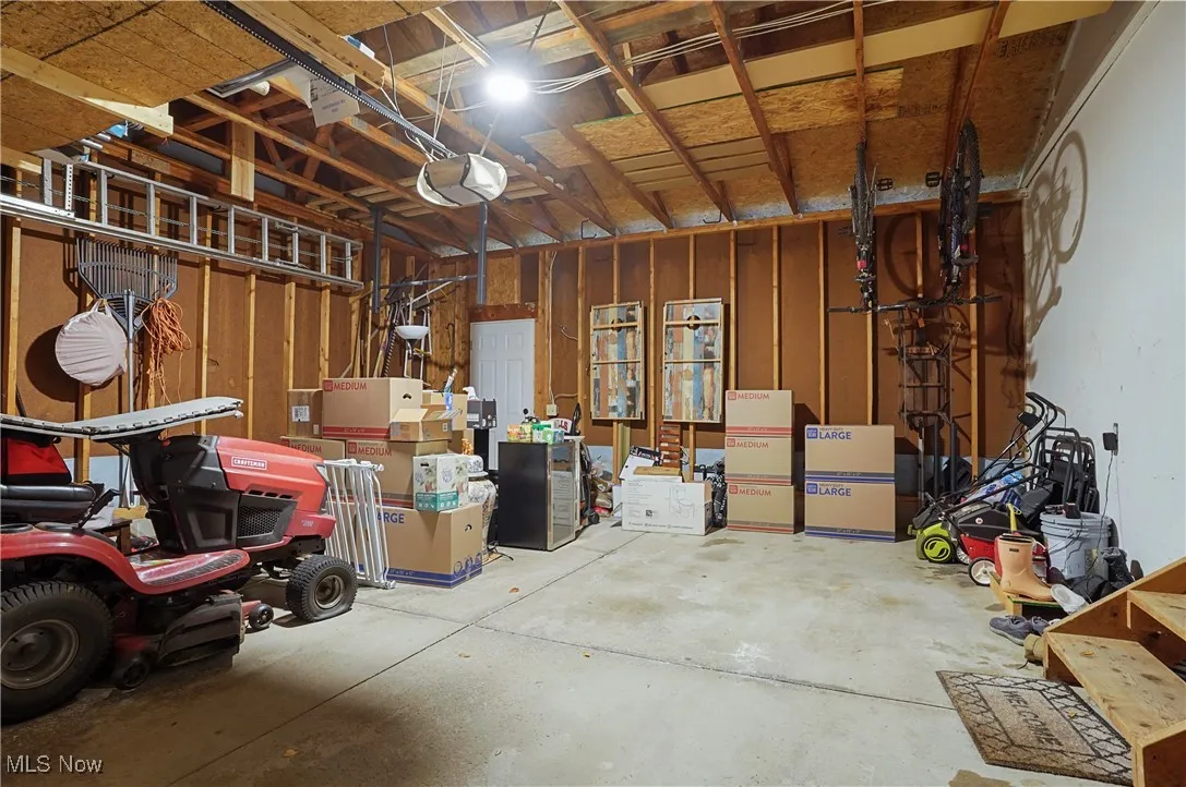 Garage featuring a garage door opener