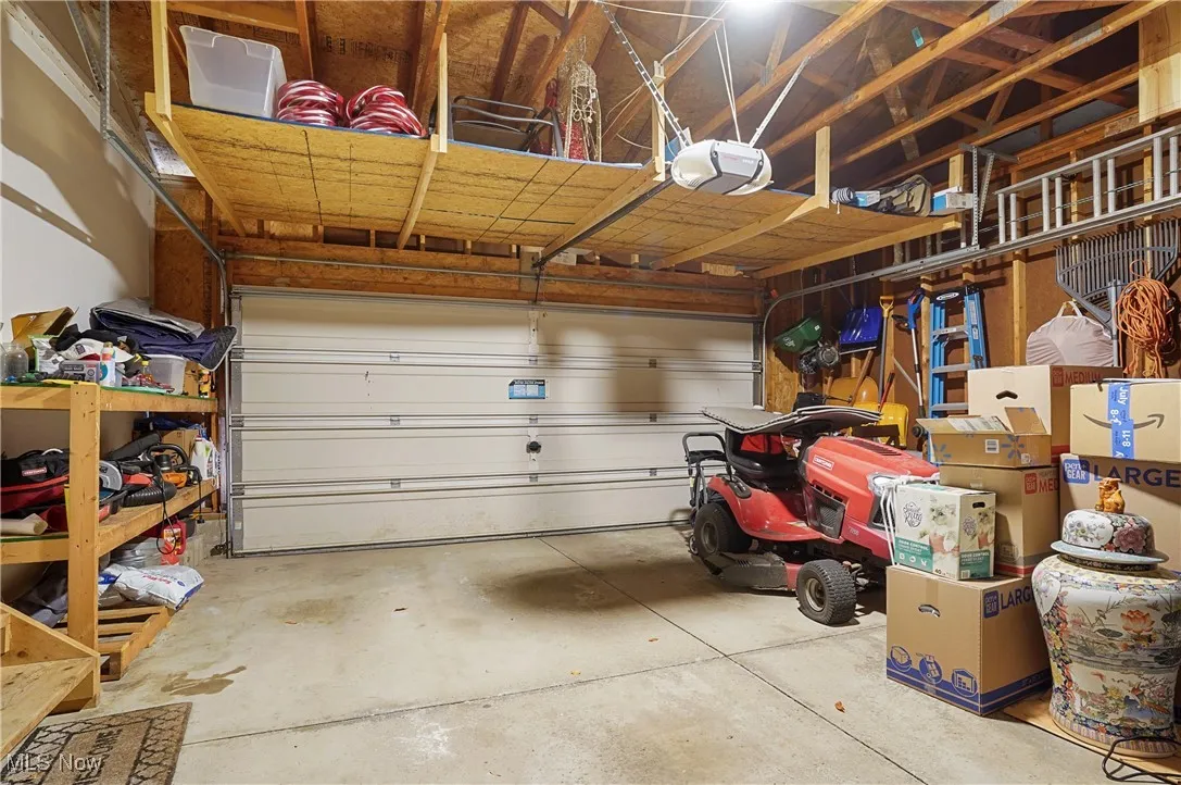 Garage featuring a garage door opener