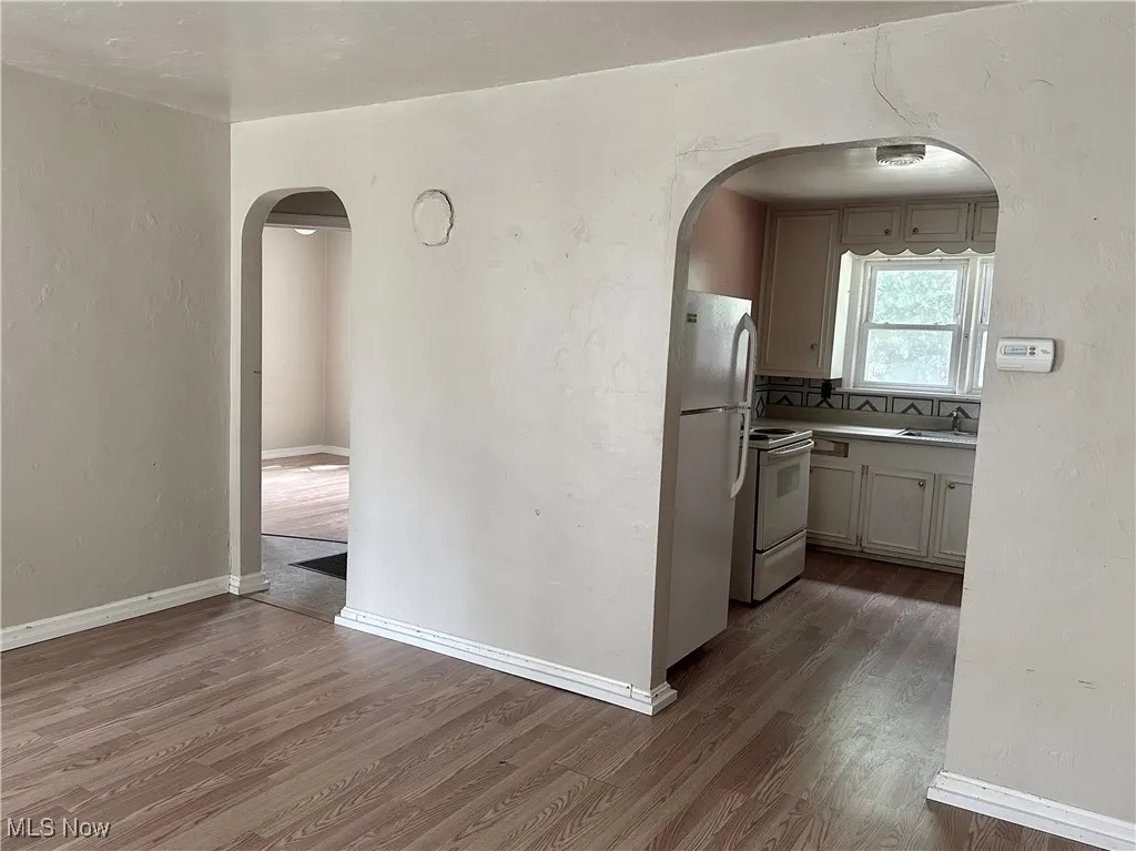 Living room with a view into the kitchen