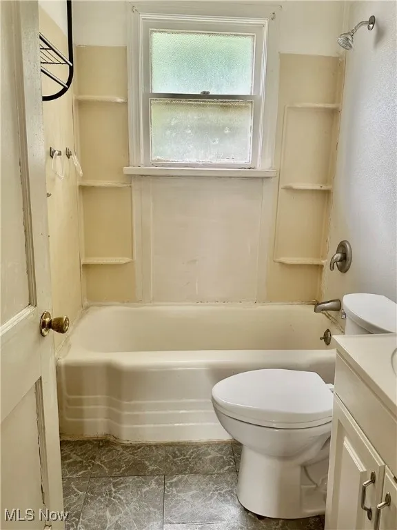 Full bathroom with vanity and washtub / shower combination