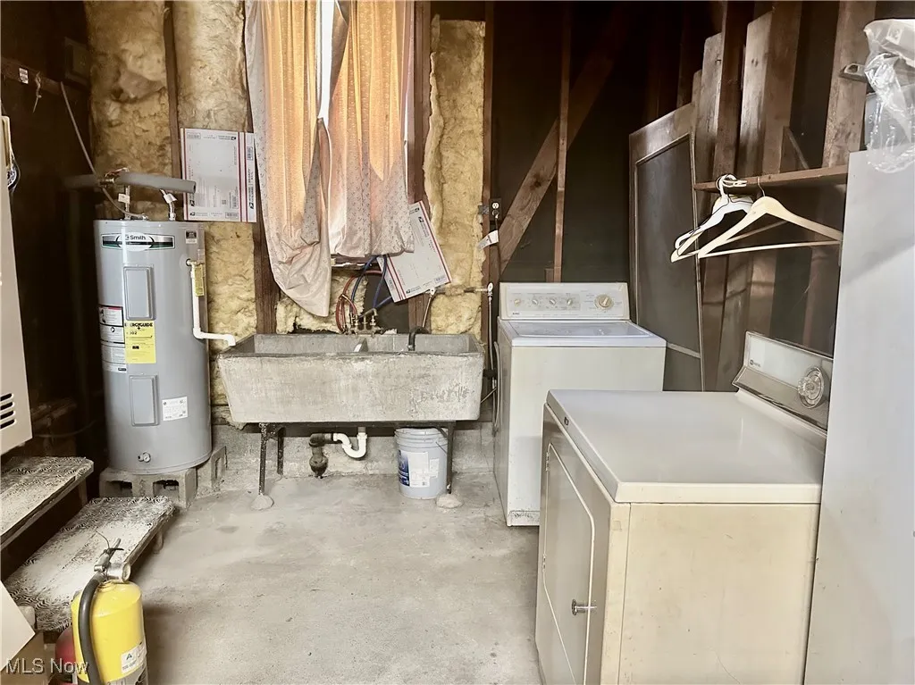Washroom with electric water heater and washer and clothes dryer