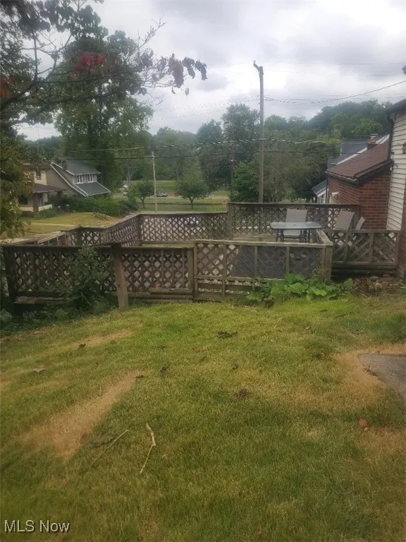 View of yard with a deck
