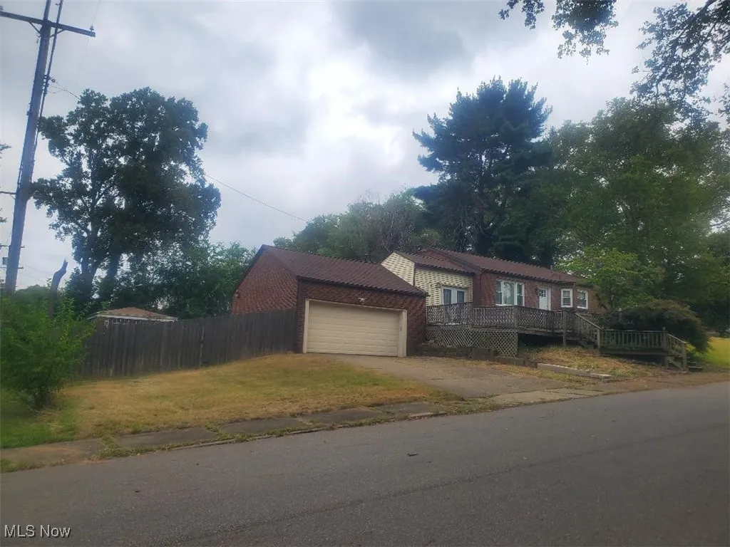 View of front of property with a wooden deck