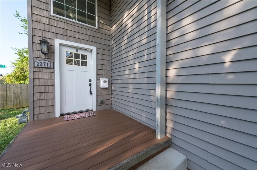 Entrance to property featuring a wooden deck