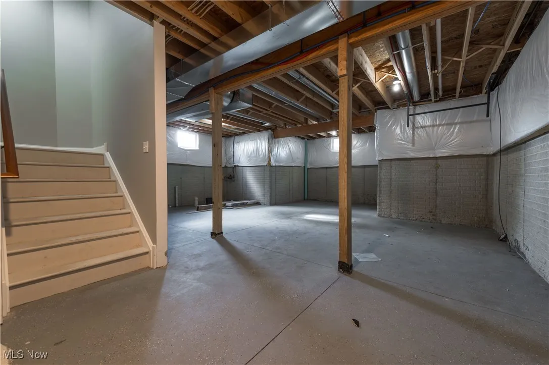 Below grade area featuring stairs