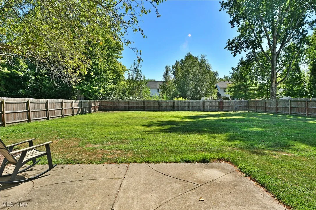 Fenced backyard with a patio area