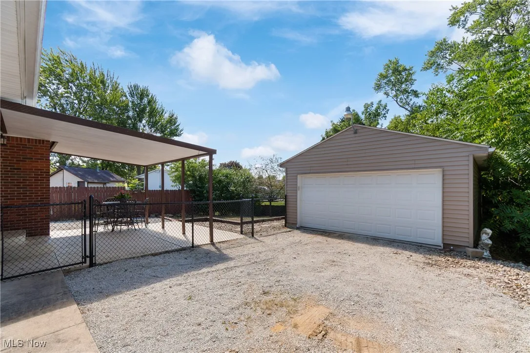 Detached garage with a gate