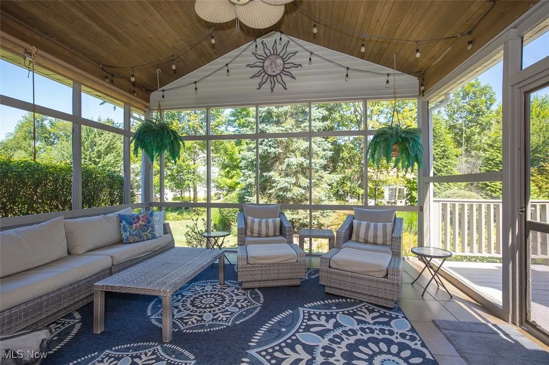 Screened sun room with vaulted wood ceiling