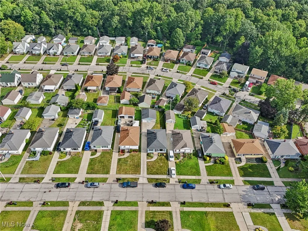 Aerial overview of property's location with nearby suburban area