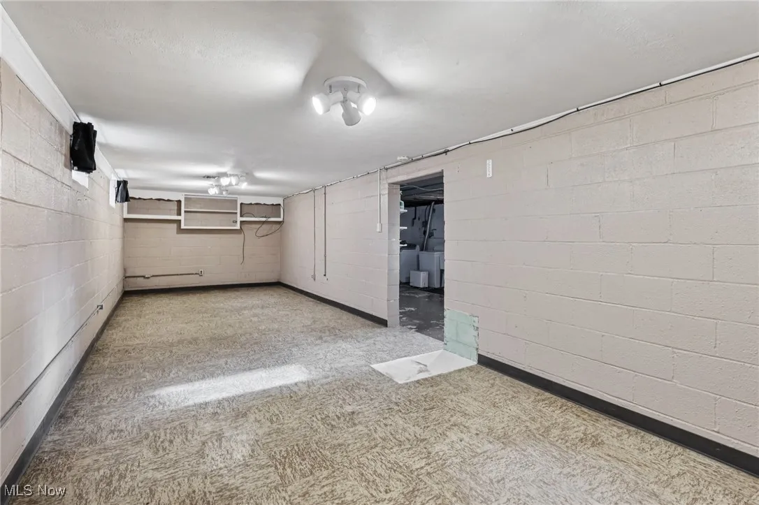 Finished basement with concrete block wall