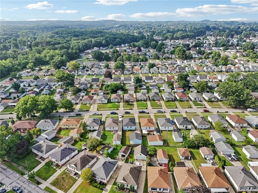 Aerial overview of property's location featuring nearby suburban area