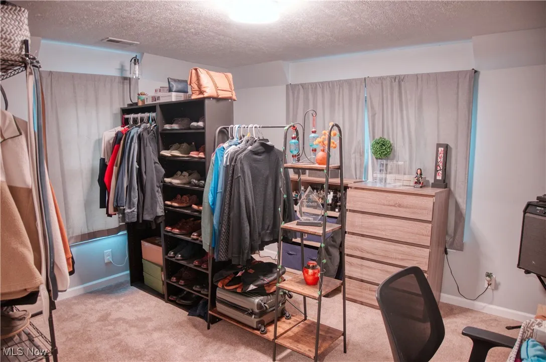 Bedroom with light colored carpet