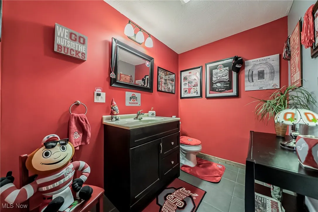 Bathroom with vanity and tile patterned floors