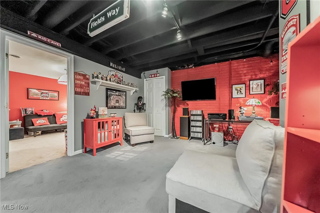 Basement with light colored carpet
