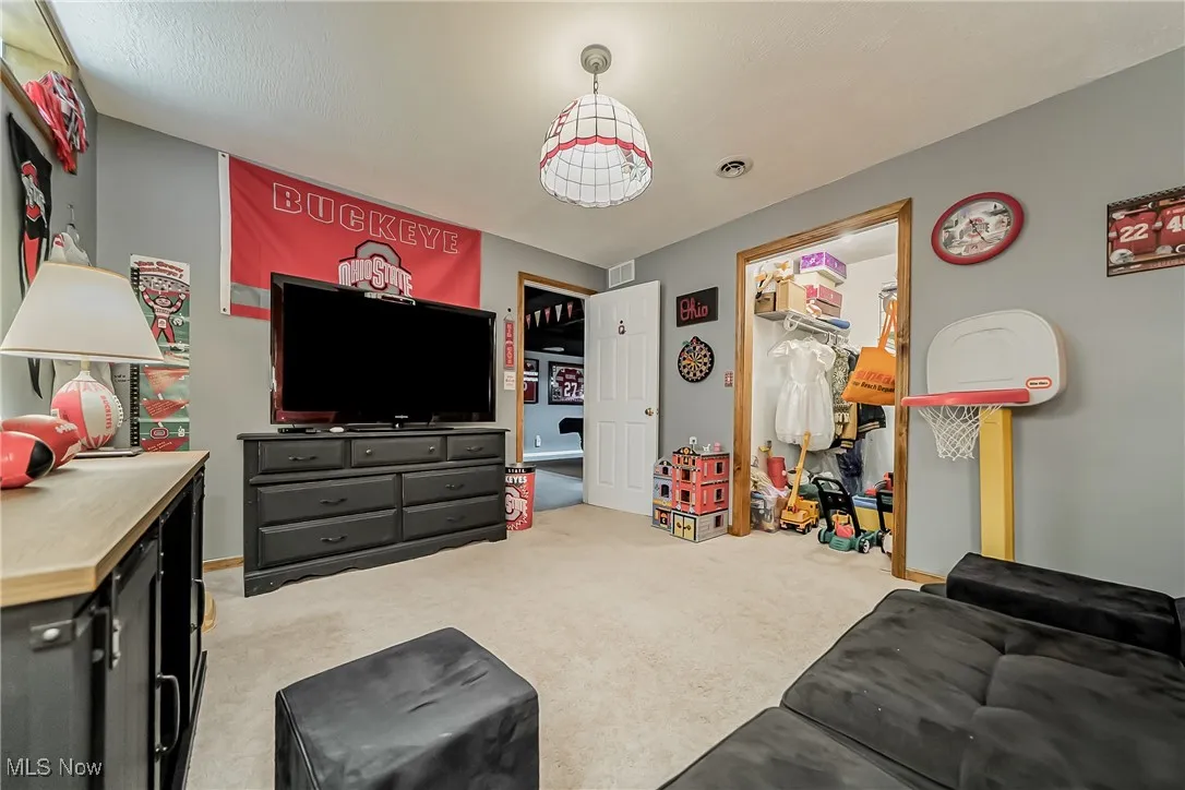 bedroom featuring light colored carpet