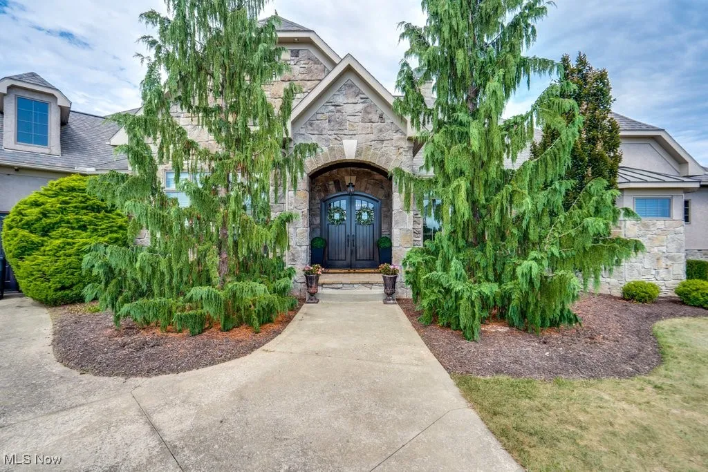 View of exterior entry with stone siding