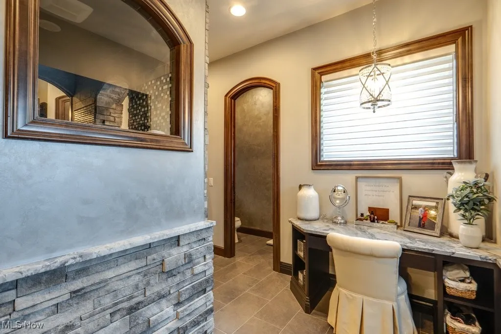 Bathroom featuring vanity, recessed lighting, and light tile patterned floors