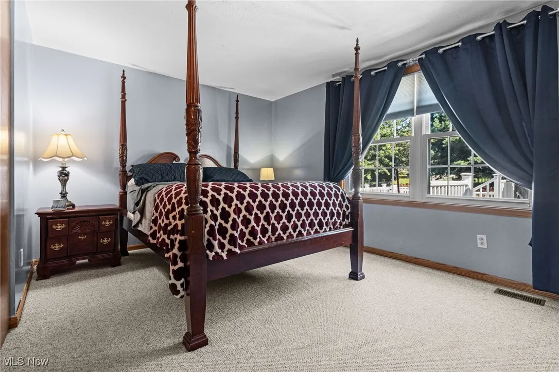Carpeted bedroom with baseboards