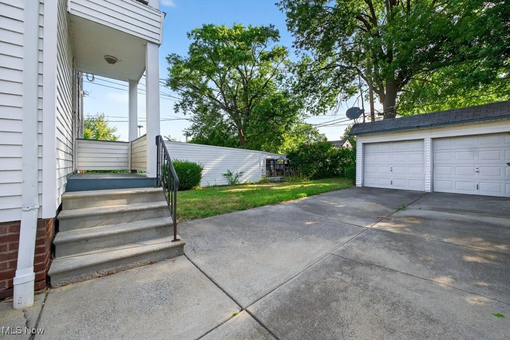 View of back yard  featuring a 2 car detached garage