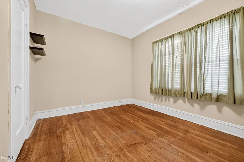 First Floor  bedroom hard wood finished floors and a closet