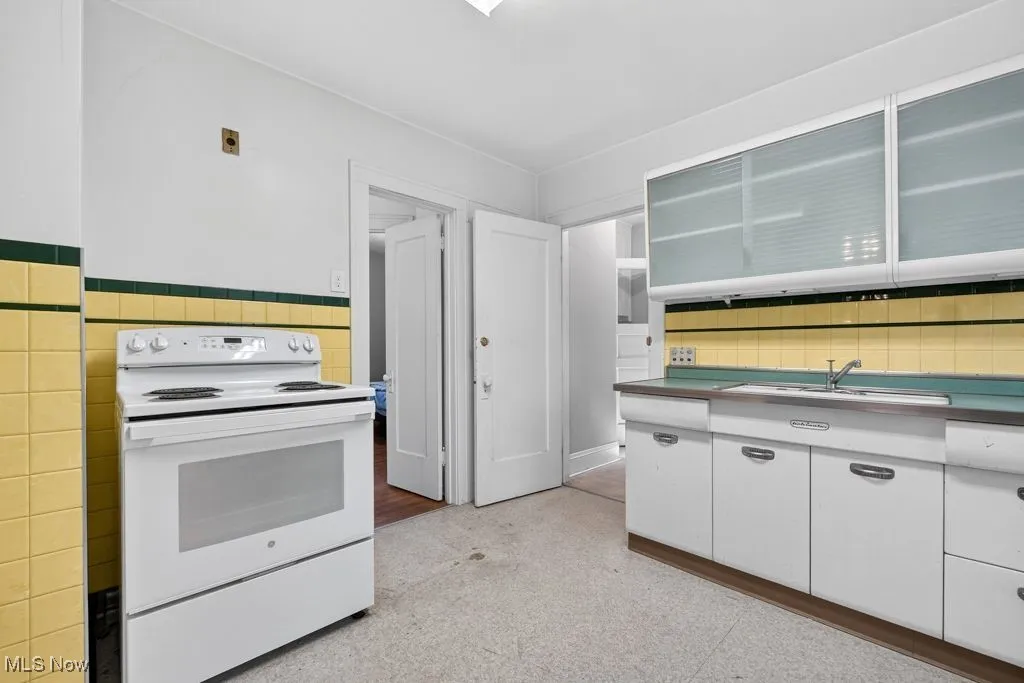 Second Floor Kitchen with white electric range oven.