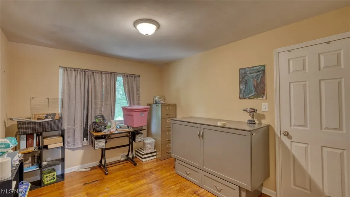 Office space with light wood finished floors and baseboards
