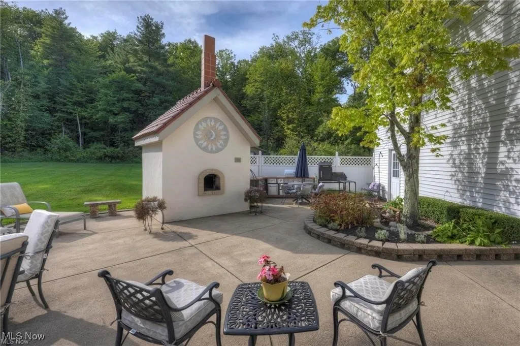 View of patio with large pizza oven