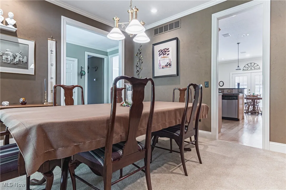 Formal dining room looking towards kitchen and main foyer