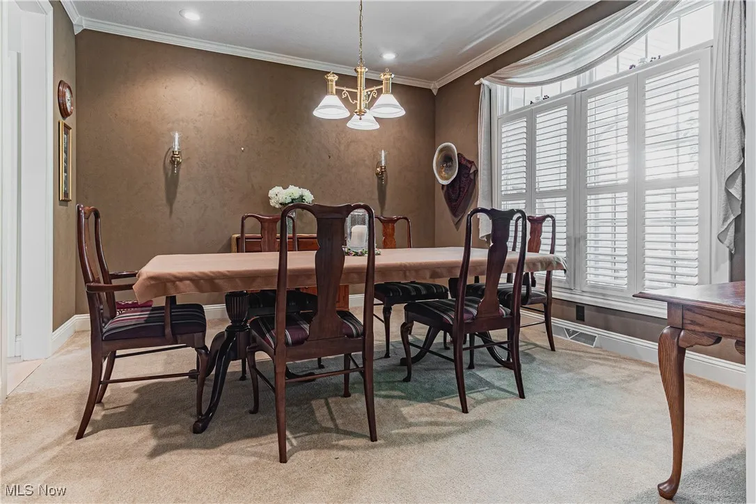 Formal dining room with more crown molding
