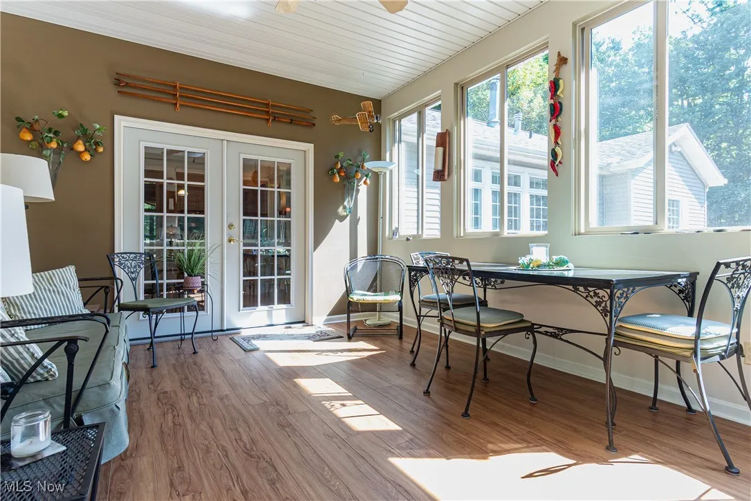 Three-seasons room looking towards home with newer flooring