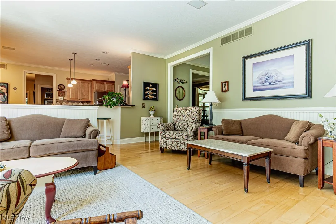 Great room with crown molding throughout