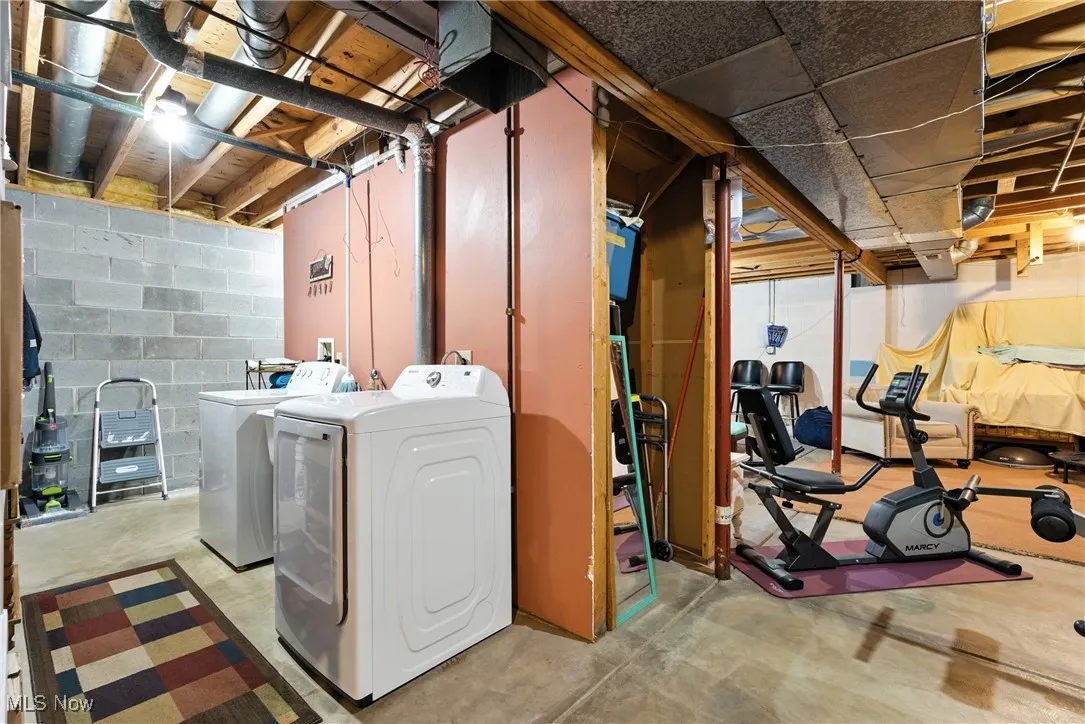Unfinished below grade area with independent washer and dryer