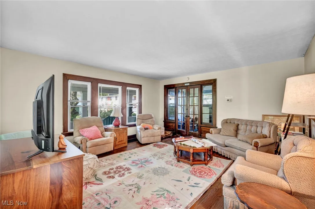 Living area with wood finished floors and french doors